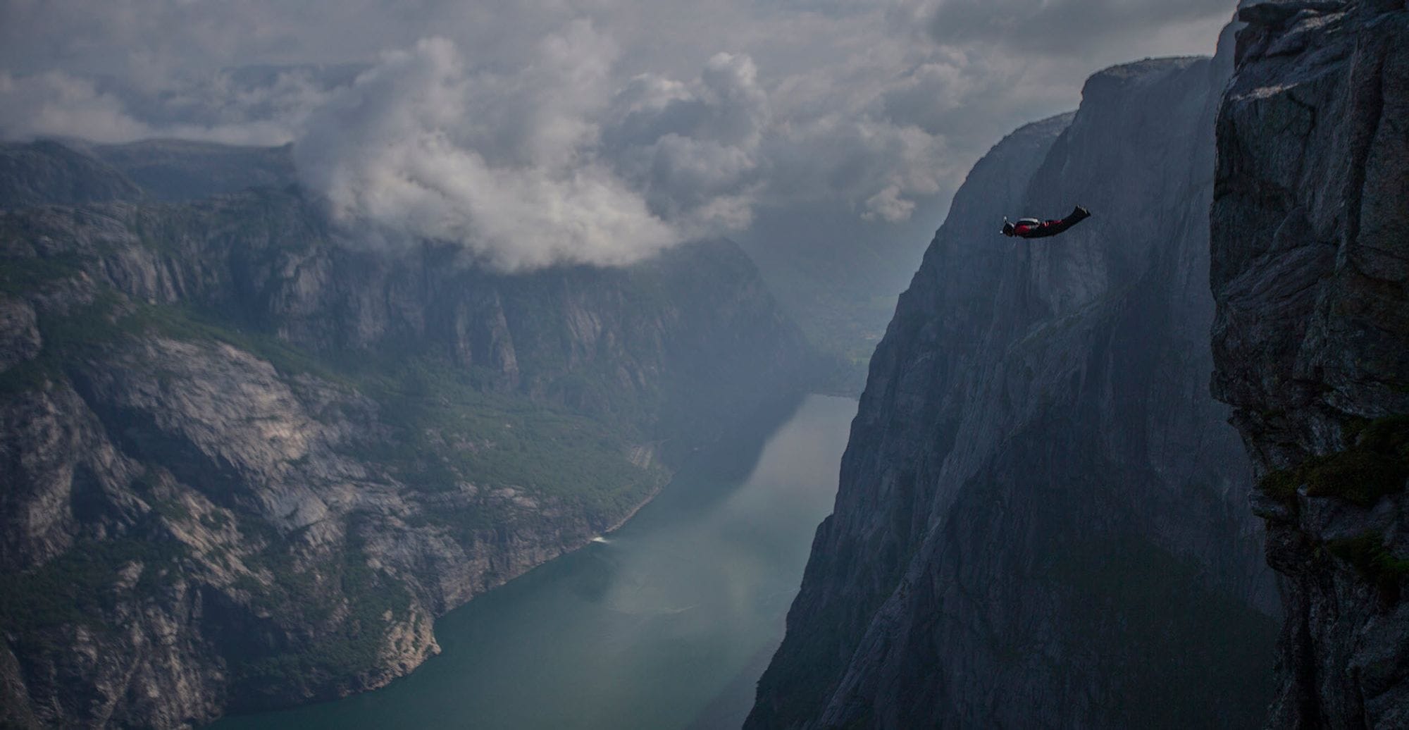 A helicopter flying over a valley