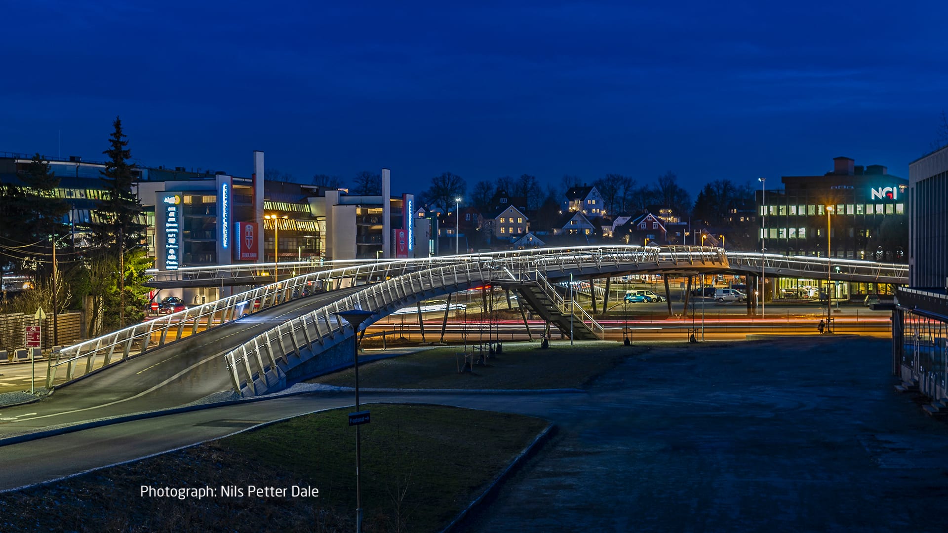 City behind bright lit bridge