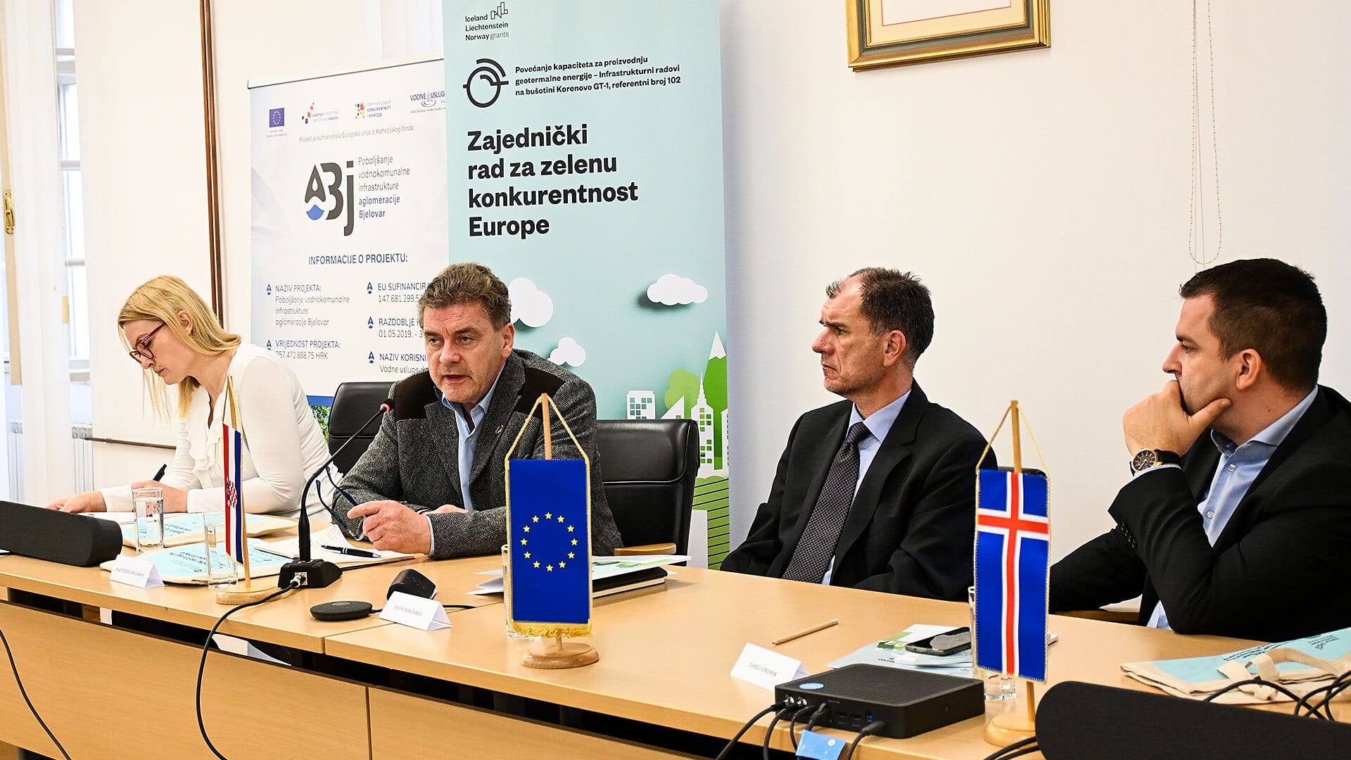 four individuals seated at Croatia conference