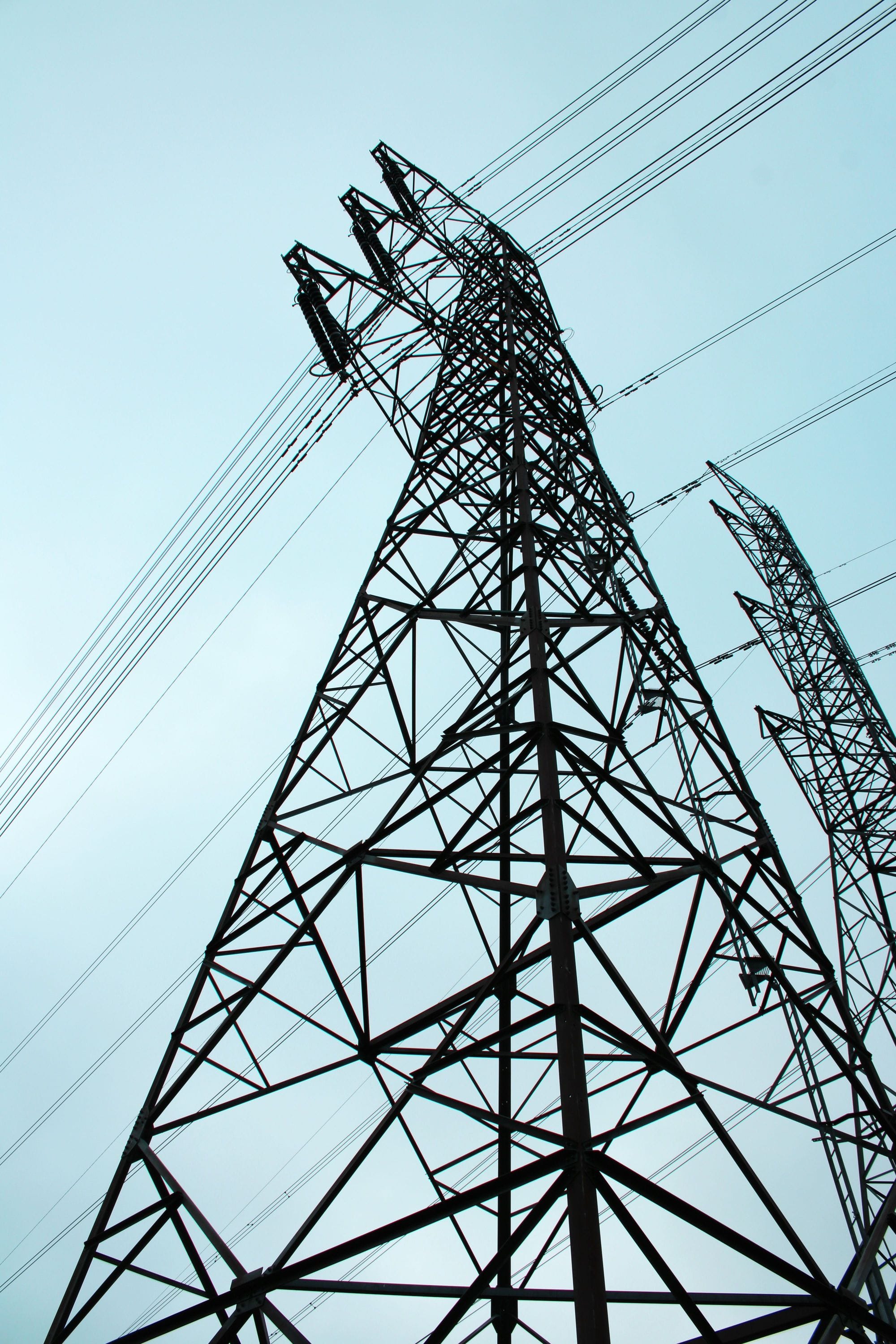 Black power mast in blue skies