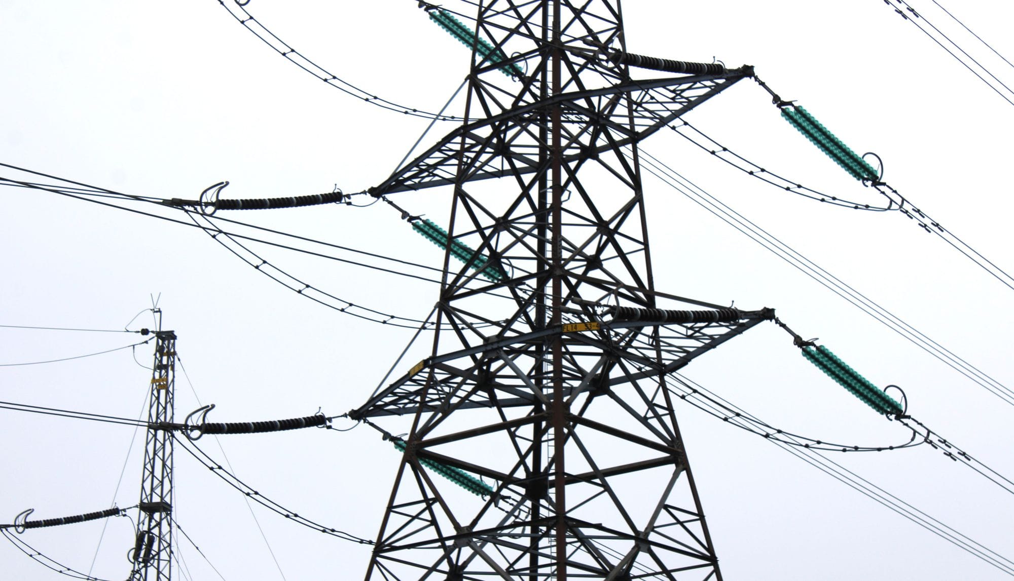 Black power mast in gray skies