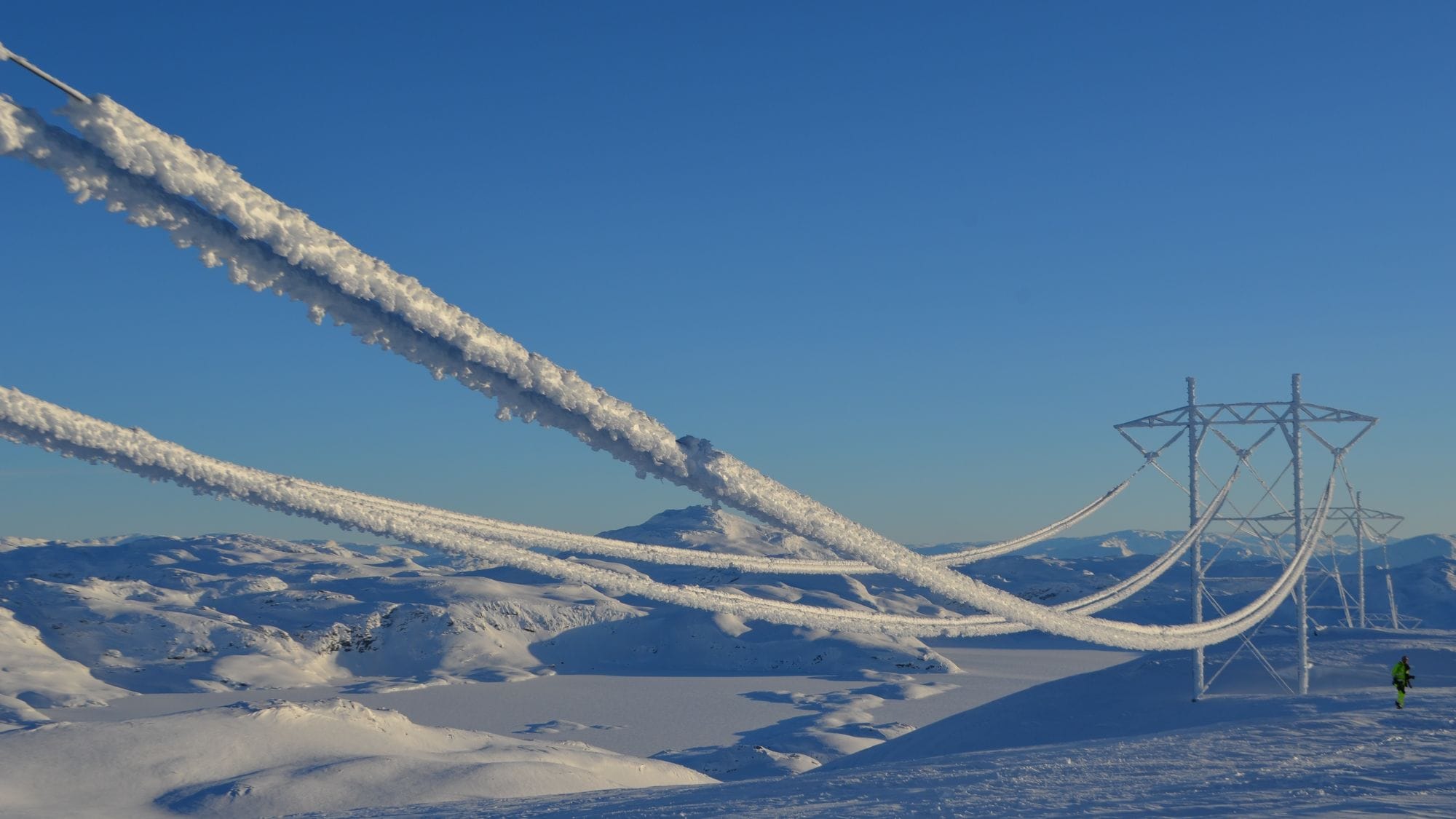 Snow covered line of transmission tower