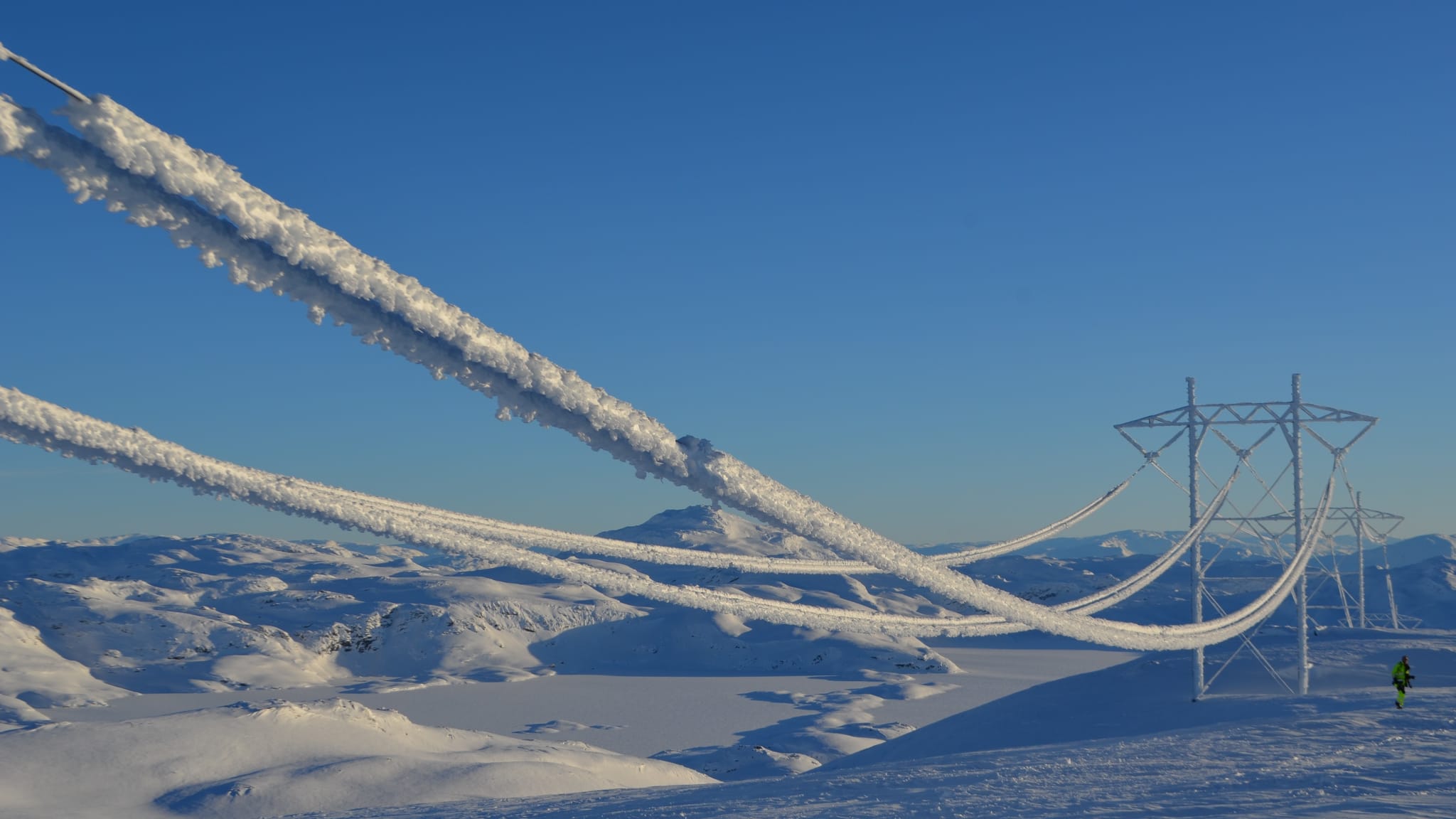 Snow covered line of transmission tower