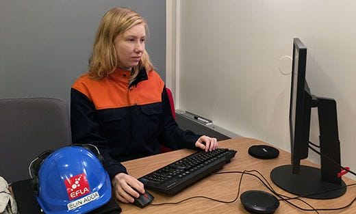 women working in a computer at a desk