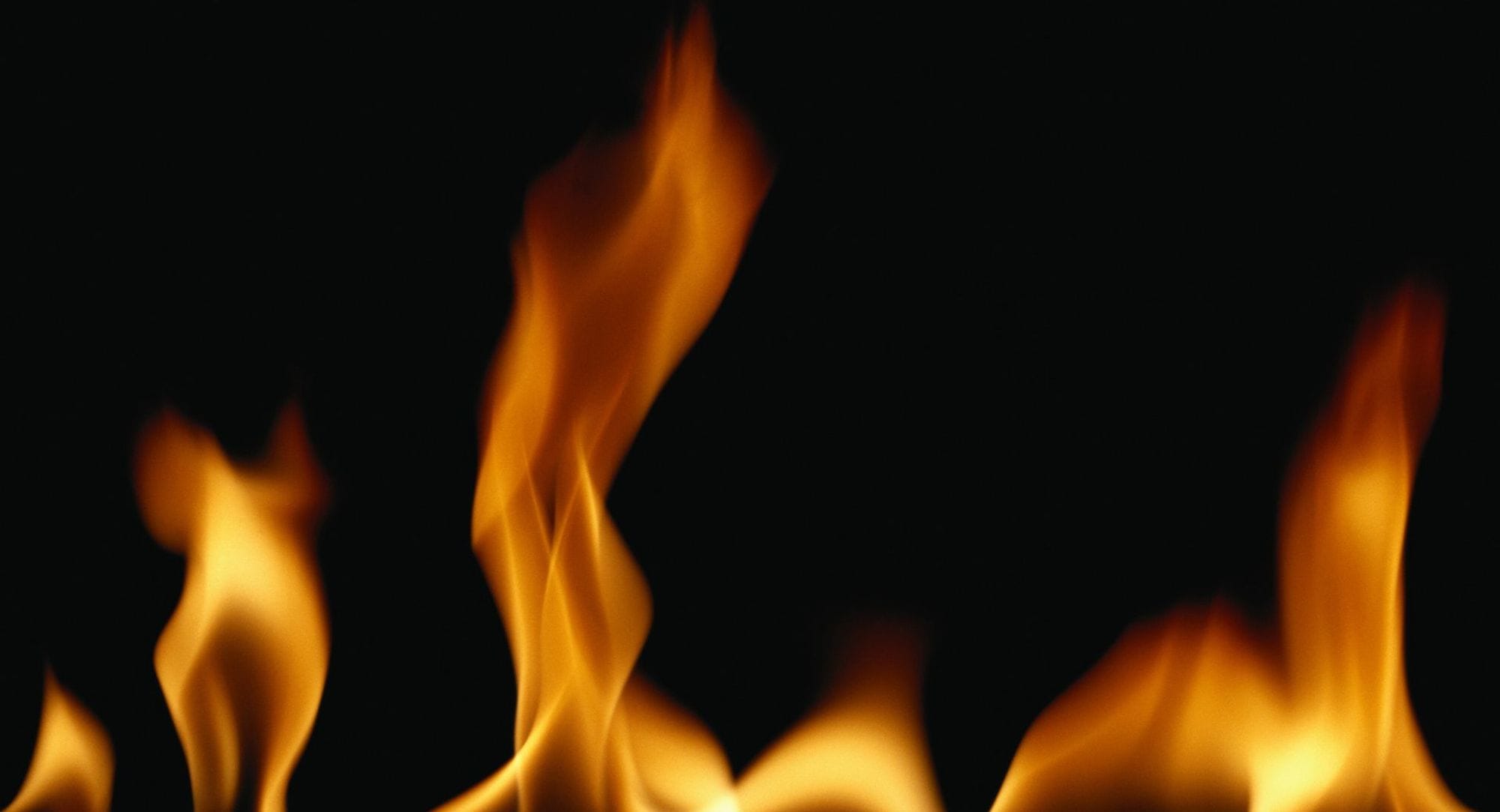 An orange flame with black background