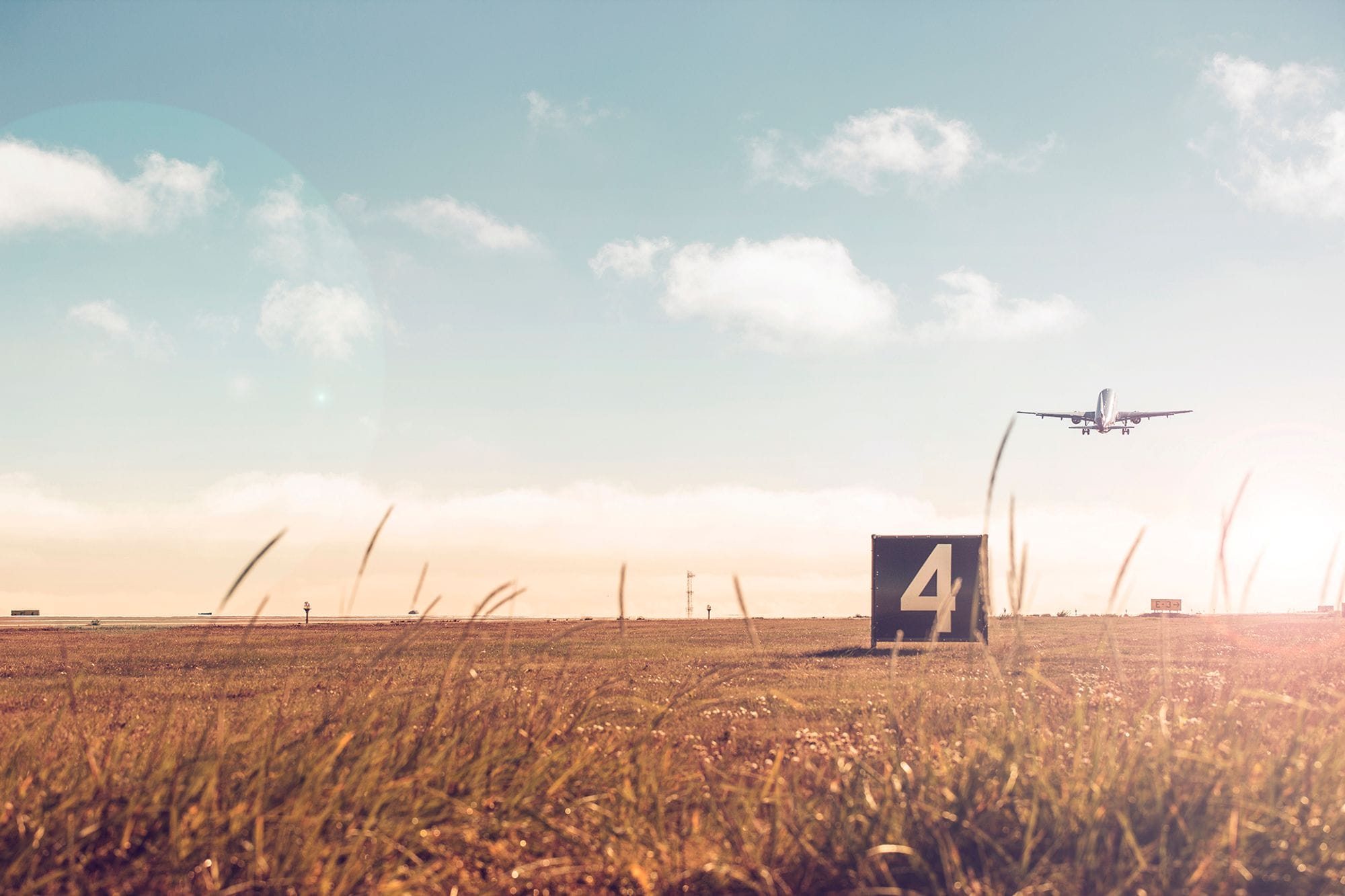 A plane taking off from a runway number 4