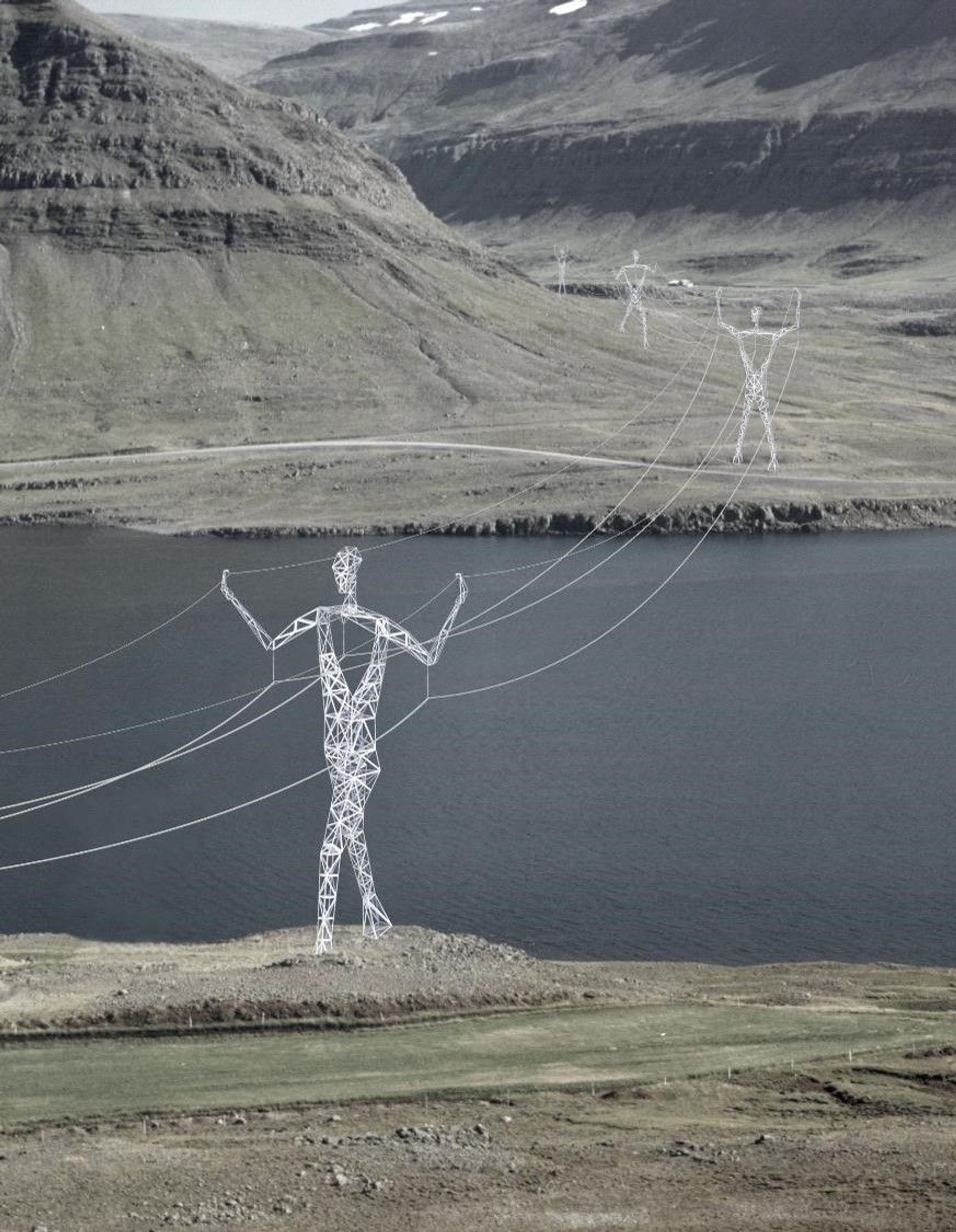 White electric towers shaped like giants in a mountain environment