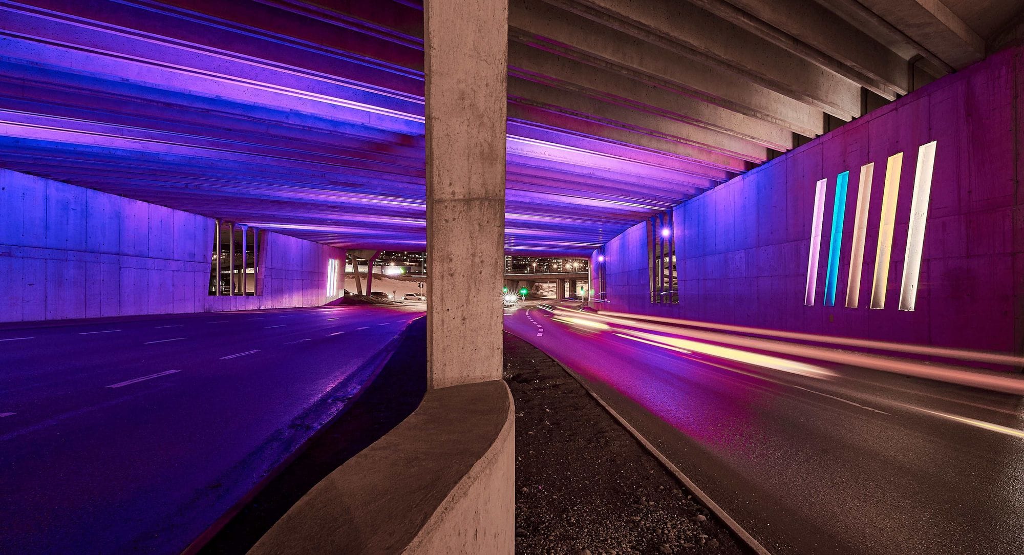 multicolour lightning design under a bridge