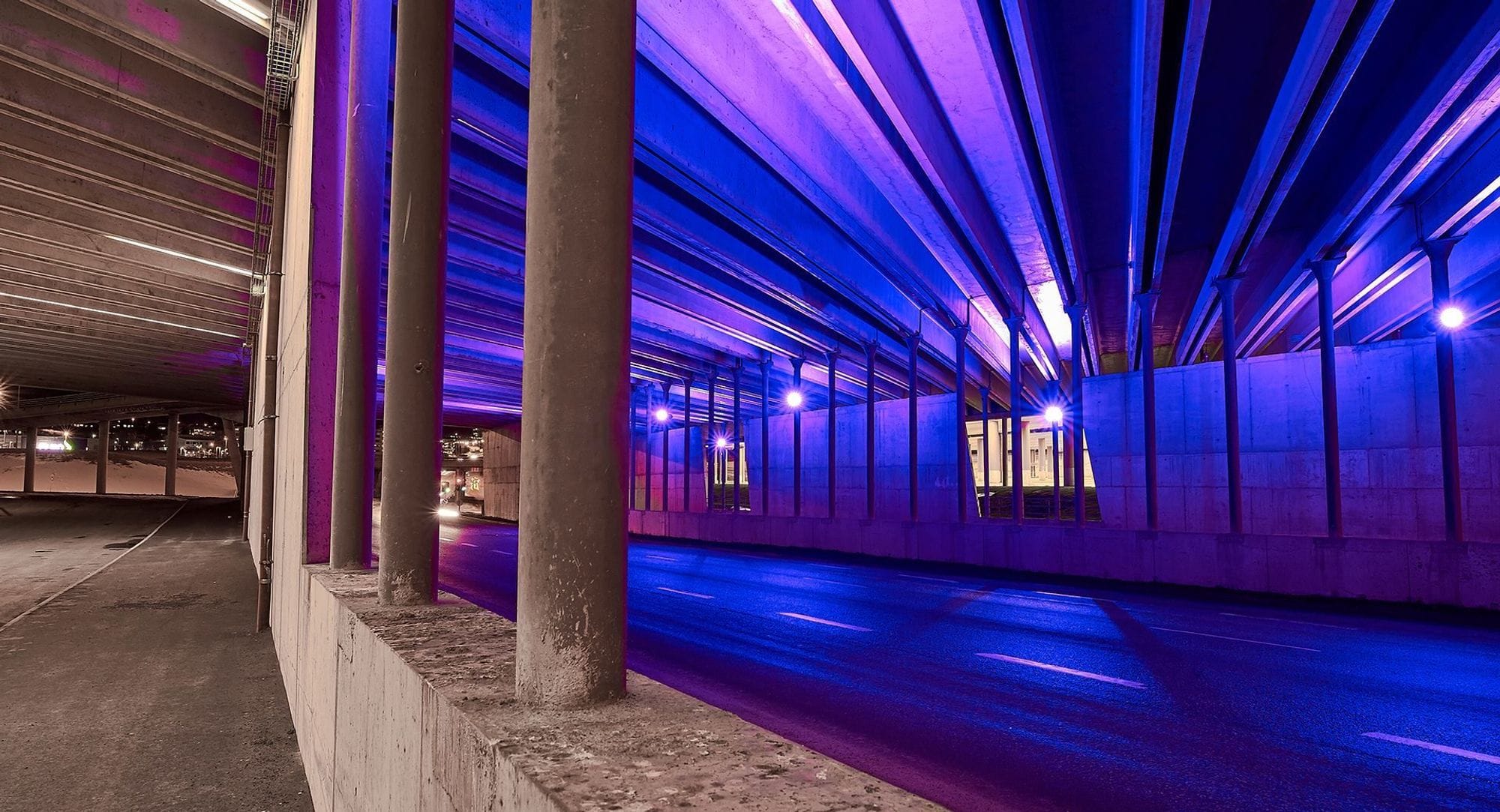 multicolour lightning design under a bridge