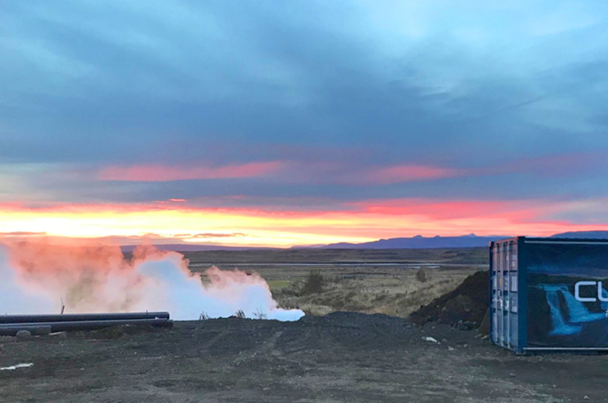 Steam rising from gravel ground at dusk