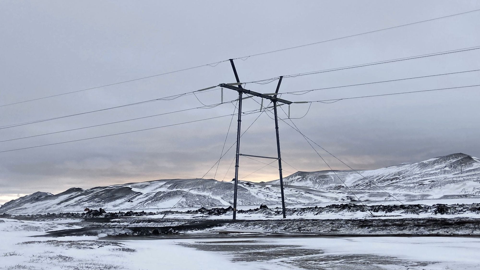 Power mast in a snowy environment