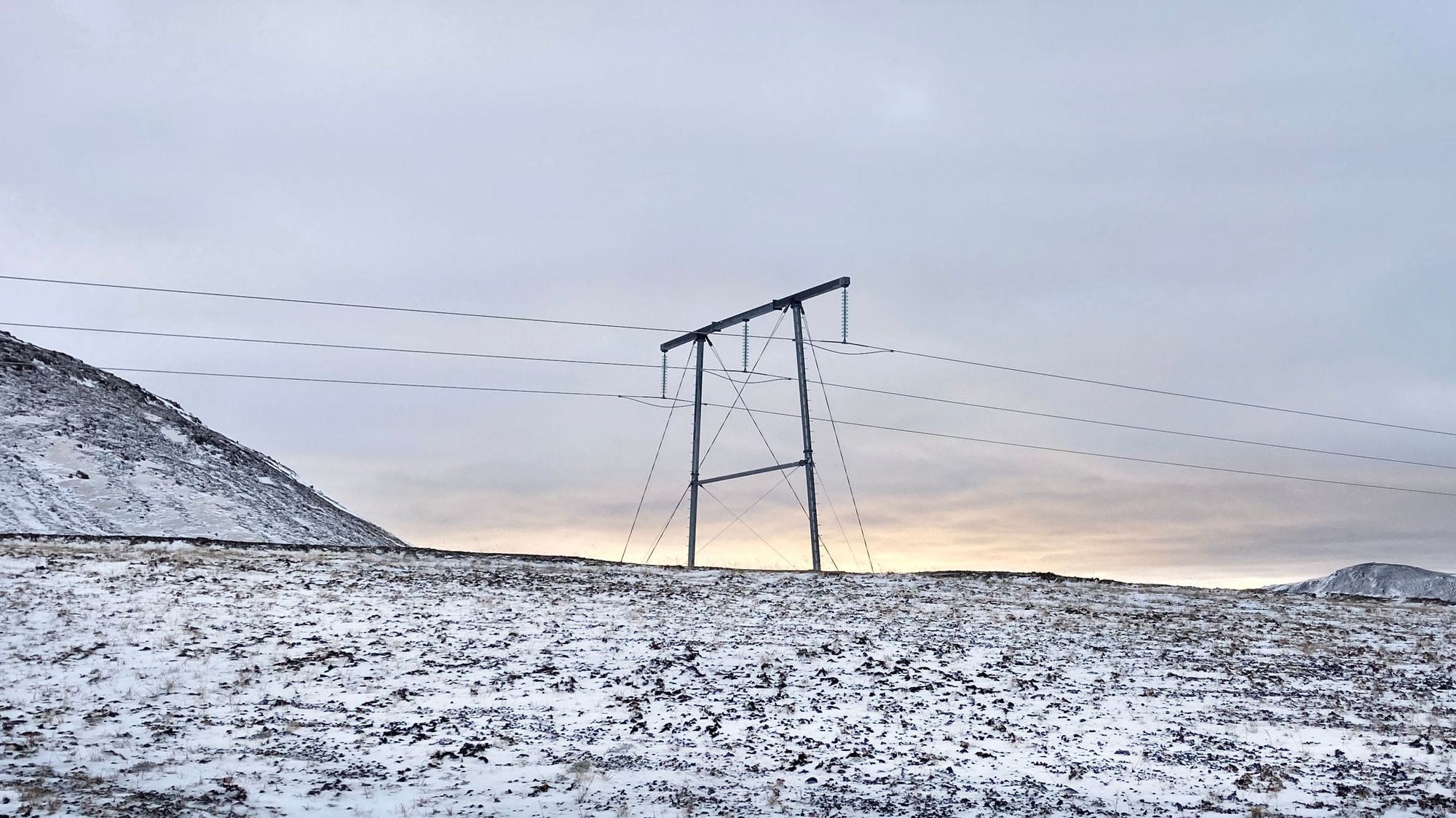 Power mast in a snowy environment