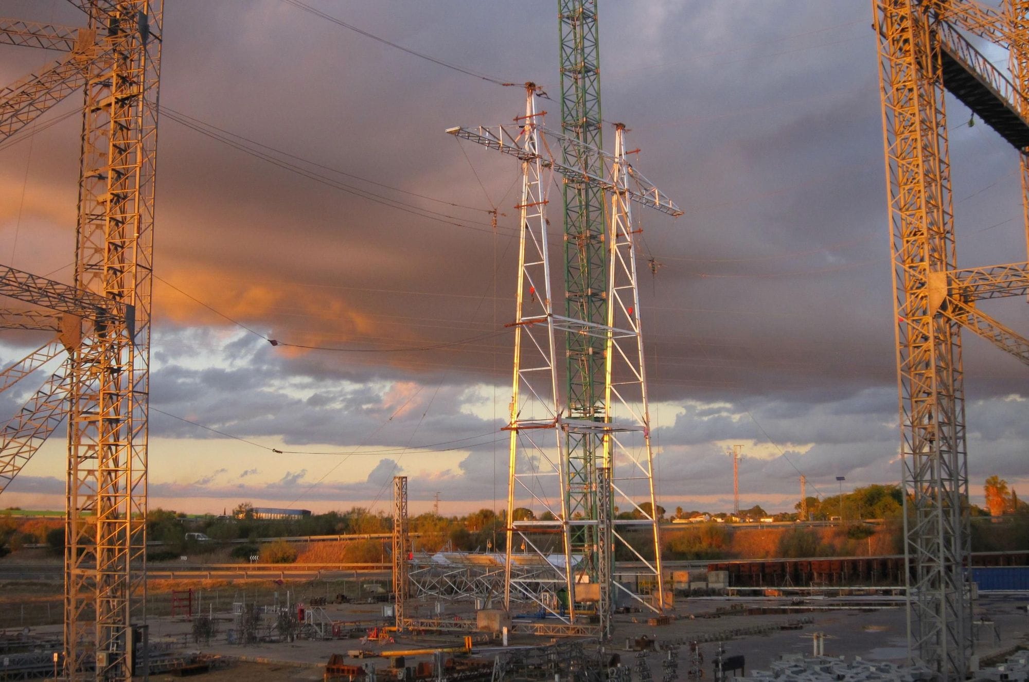 an aluminum mast in a construction site in a orange sunset athmosphere