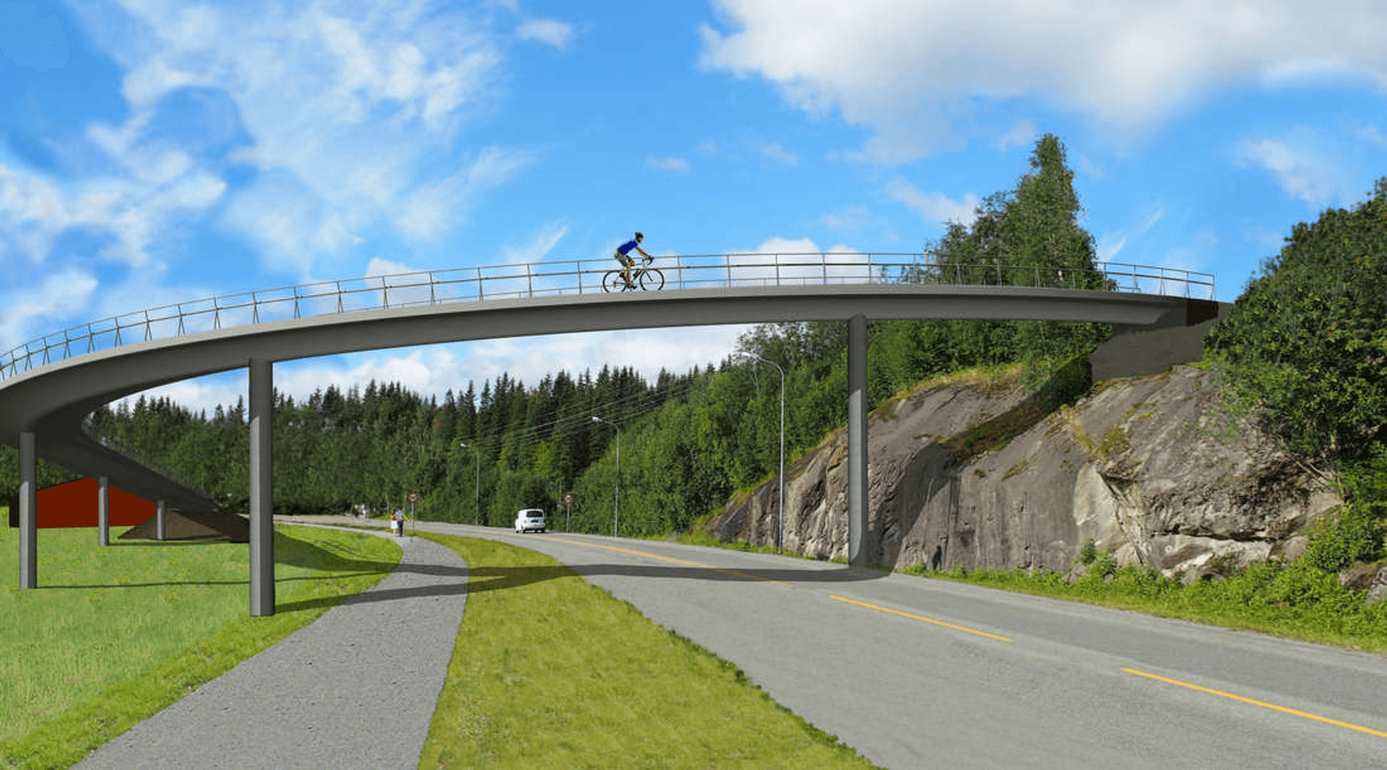 Cyclist crosses a bridge that crosses the road and footpath