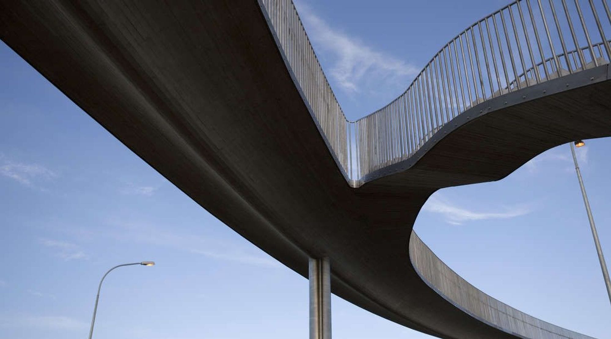 seen under a footbridge that lies in two branches and merges into one