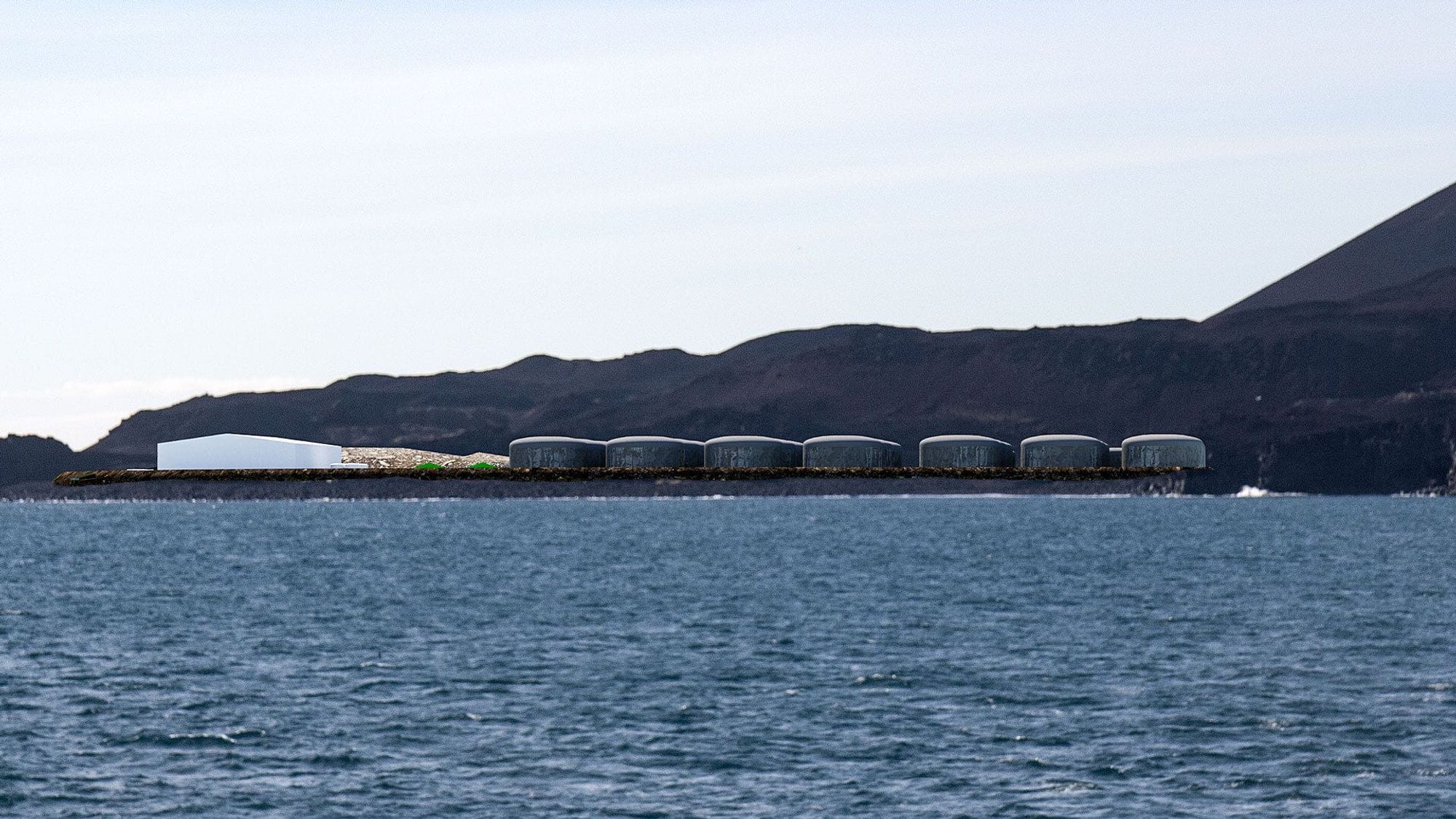 Oil tanks at the pier, looking over the sea and the mountains. Computer drawing