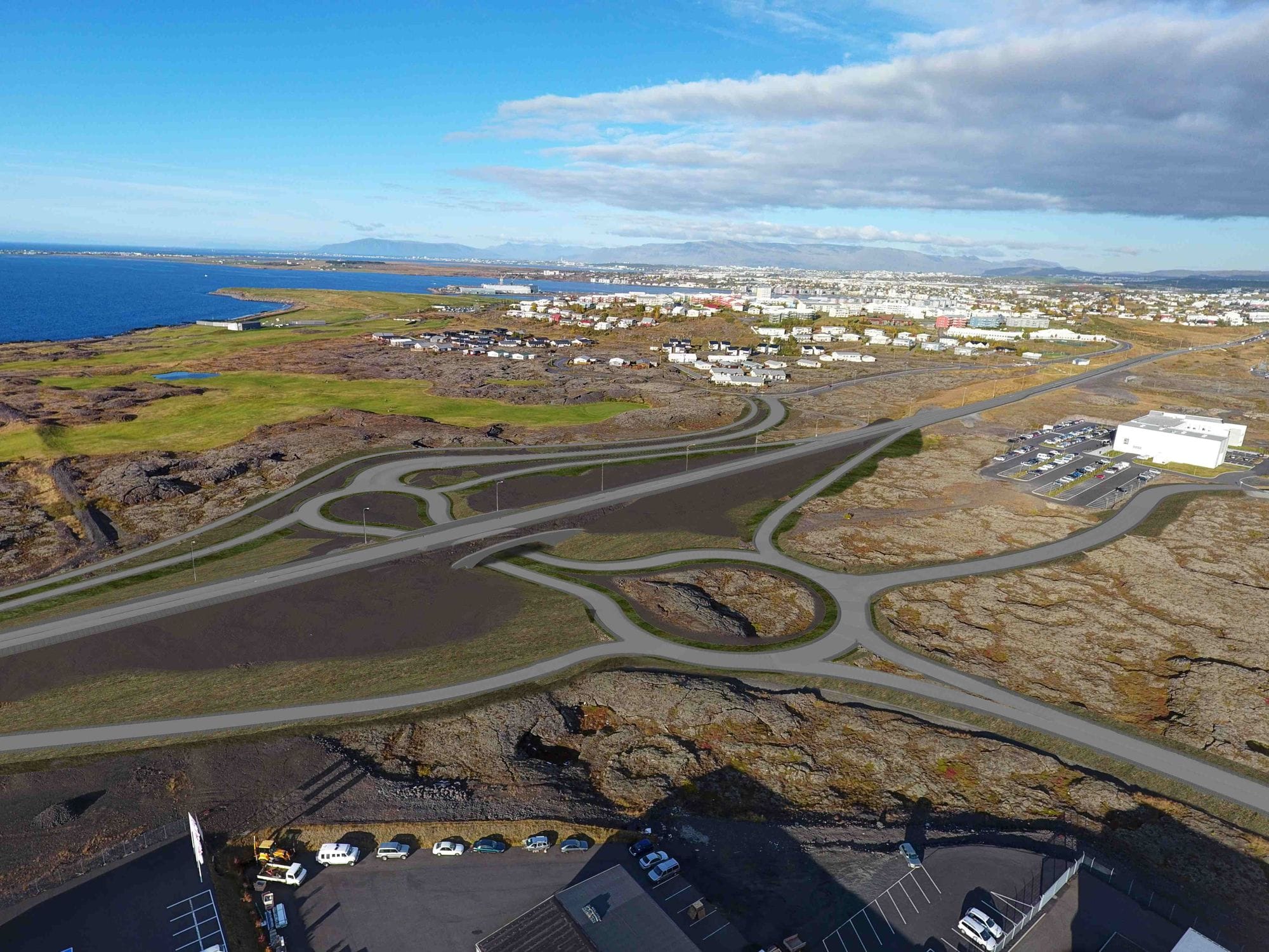 Overview of a populated area surrounded by lava fields, picture shows roads after changes: one straight road and other aligned and curved, going under the straight road