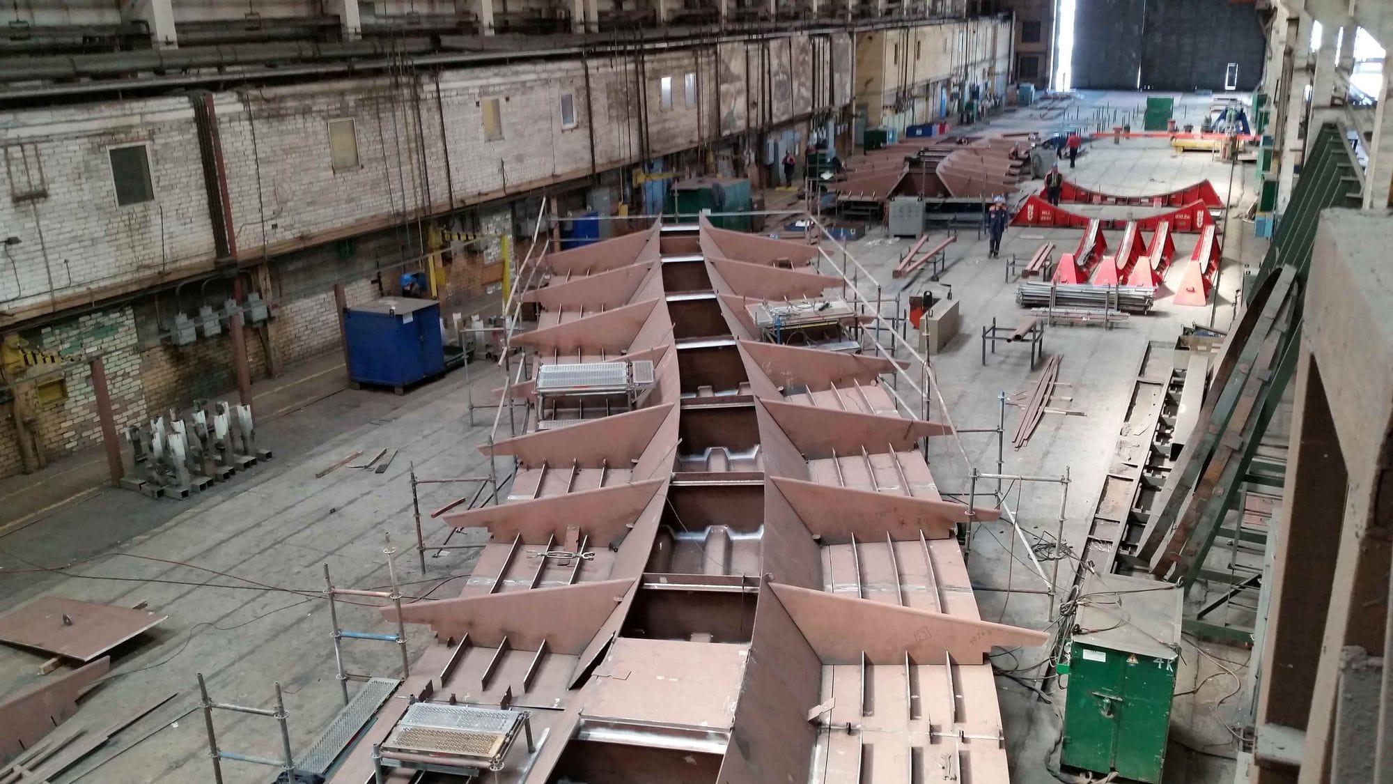 one of 16 parts of the bridge being built and laid out inside a construction workshop