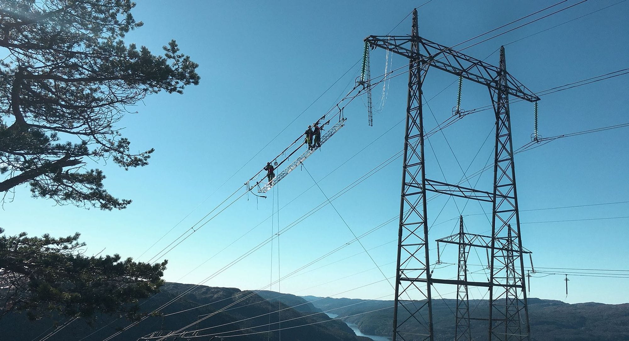 Transmission lines with blue sky in the background