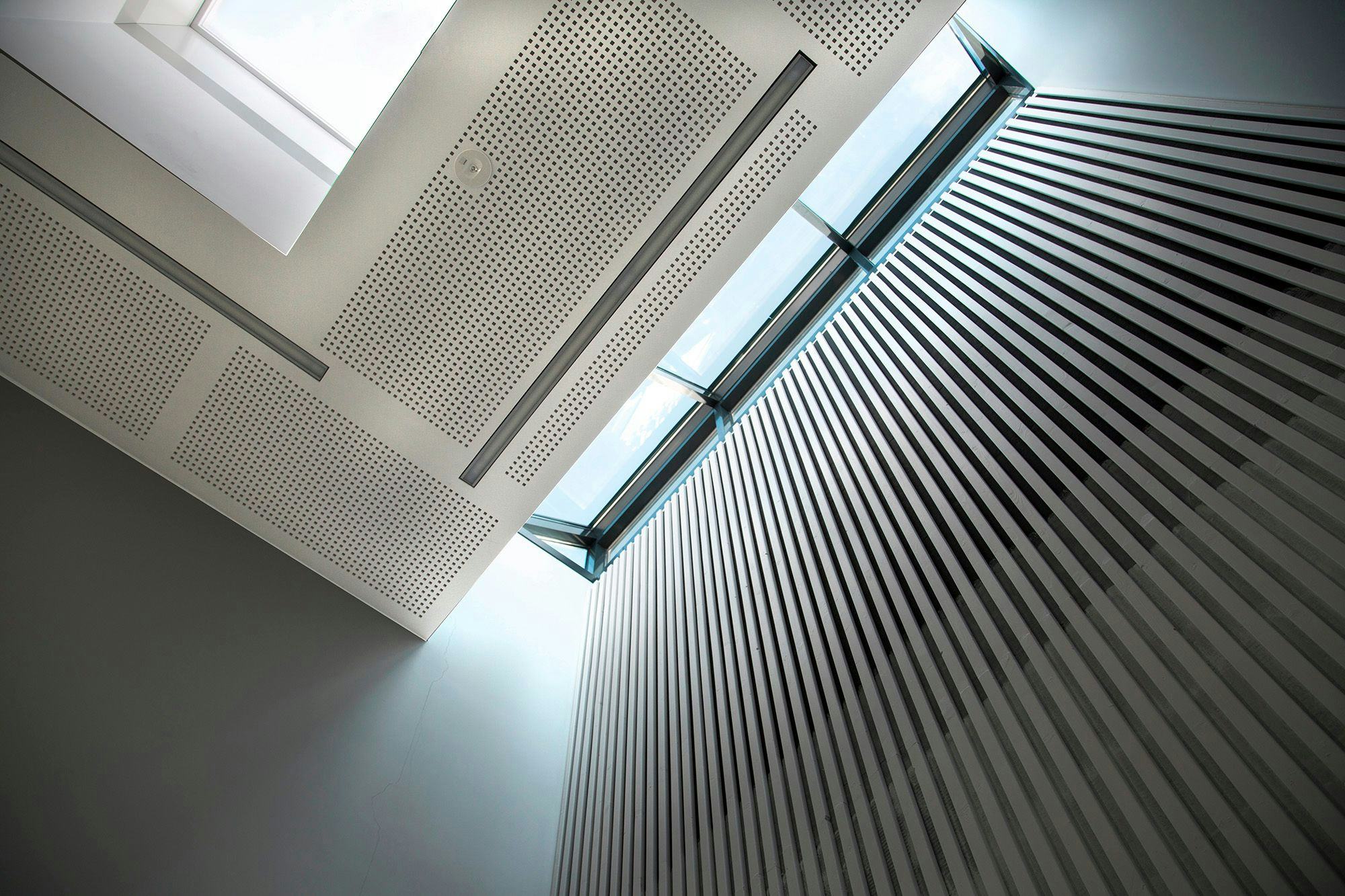 Ventilated white ceiling with glass windows