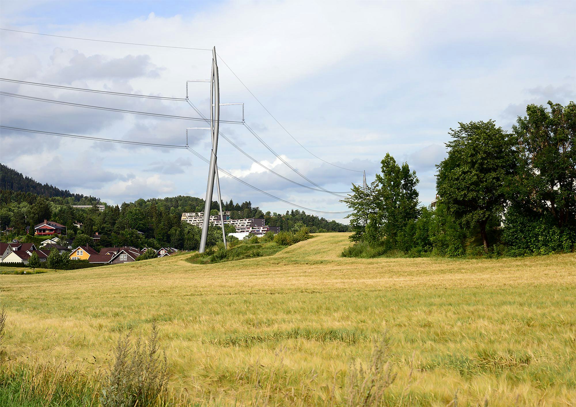Transmission tower centered on a green field , trees on the right and houses on the left 