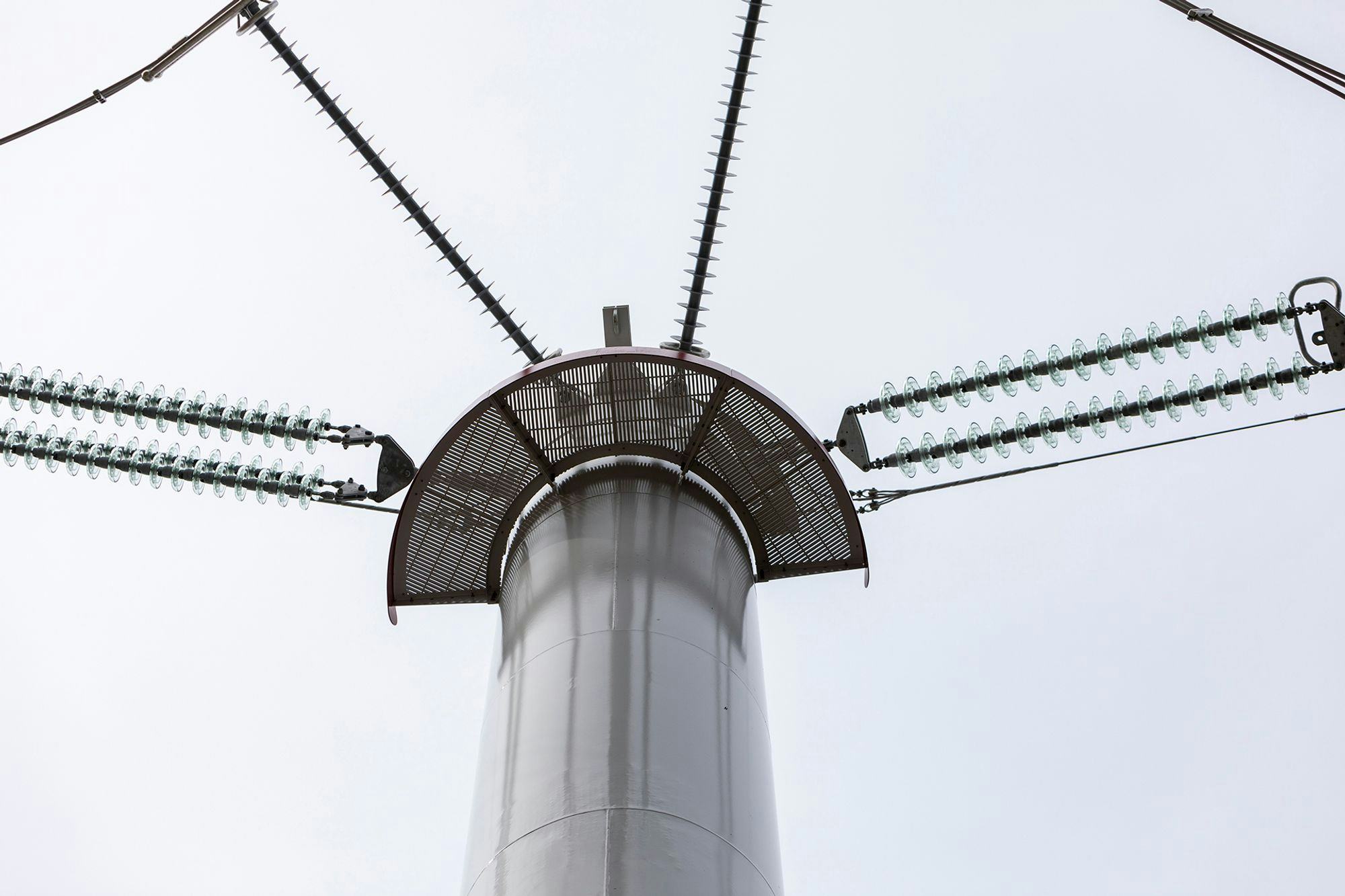 Close up shot of top of a transmission tower