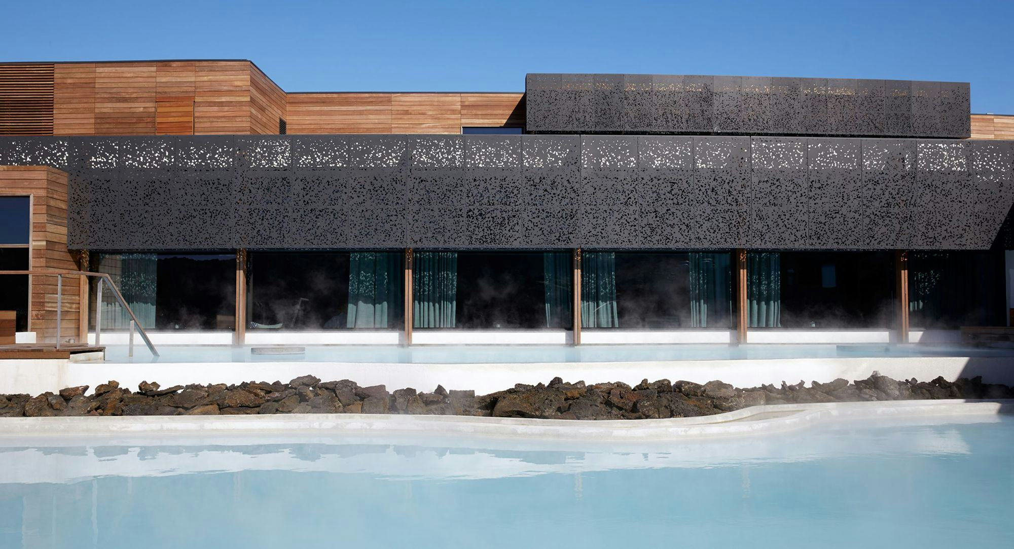 geothermal pool Infront of a modern black building