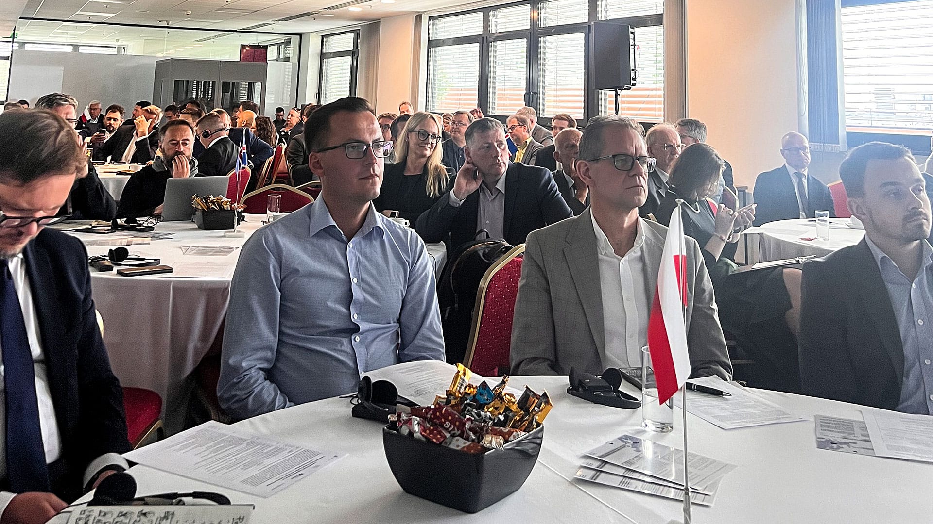 People seated in a conference meeting