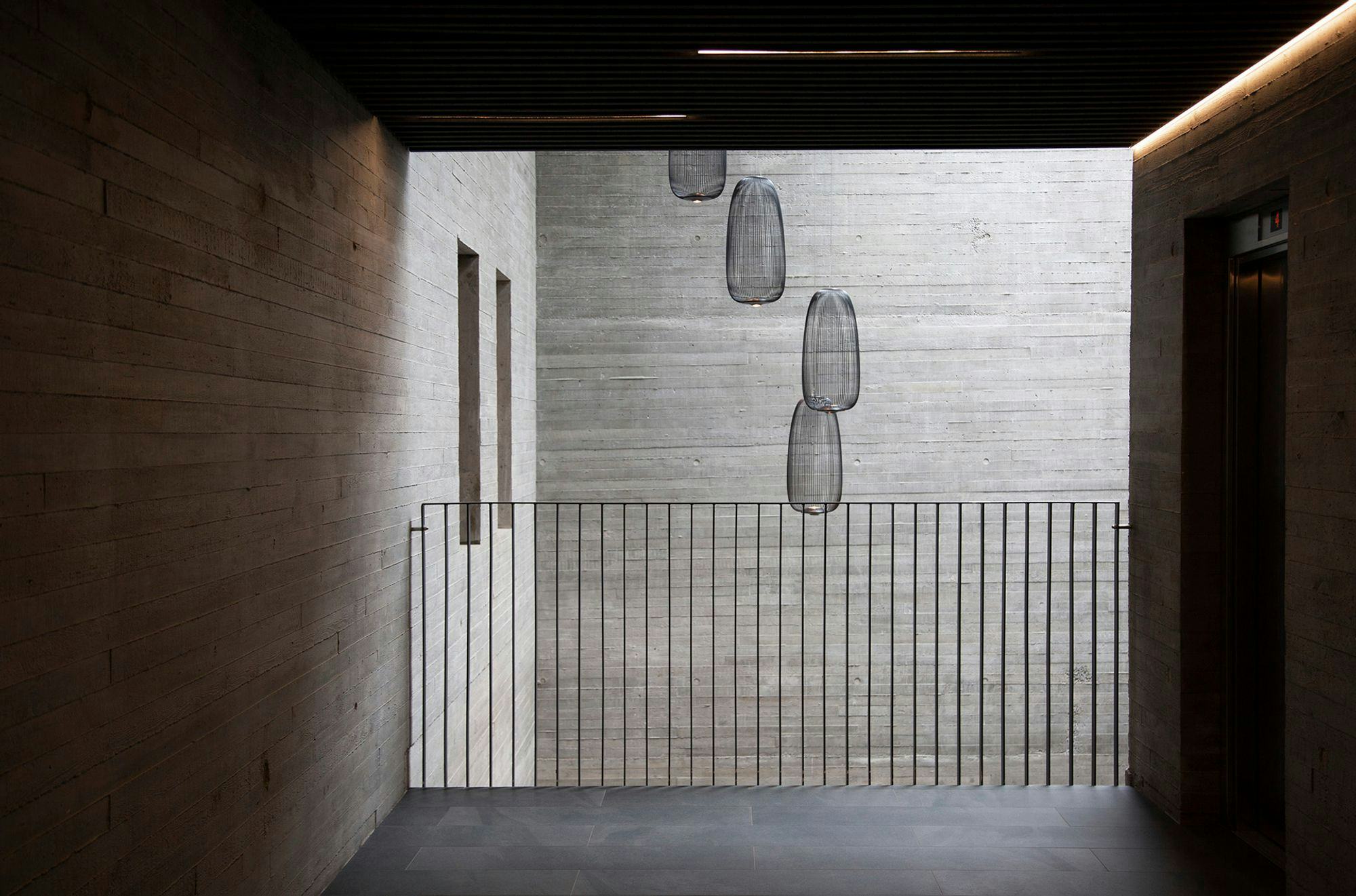 Interior of a concrete building with metal railing