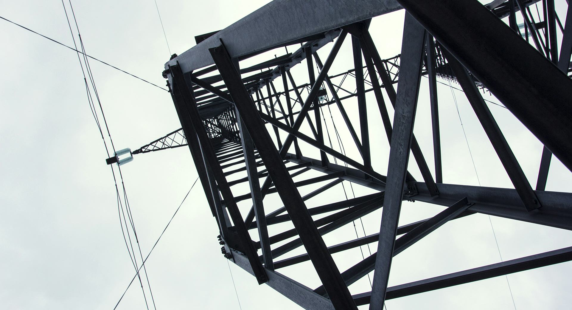 Close up shot of transmission tower in black and white 