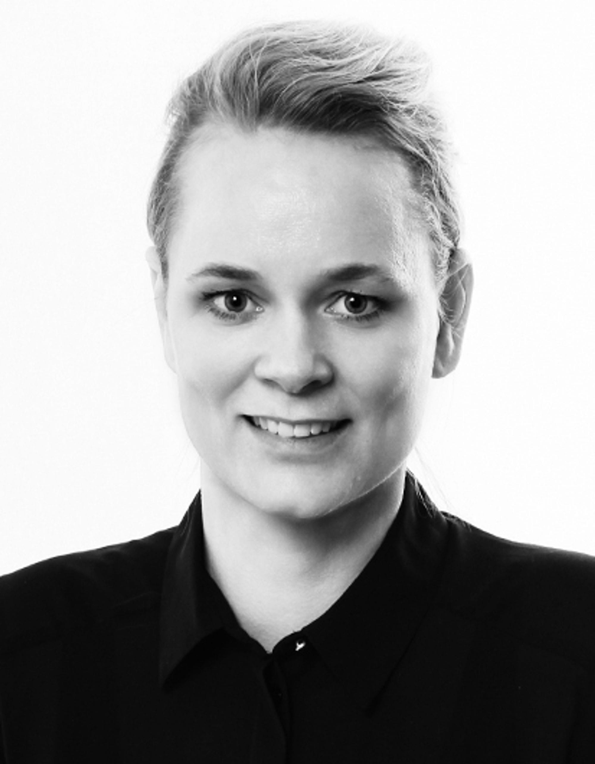 Portrait of a woman, pale blue background