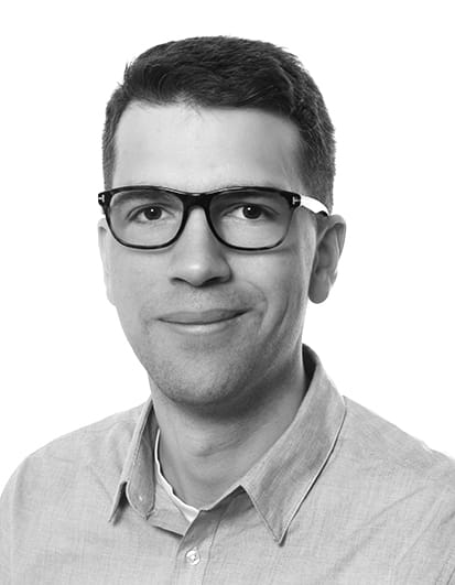 Headshot of a man with glasses