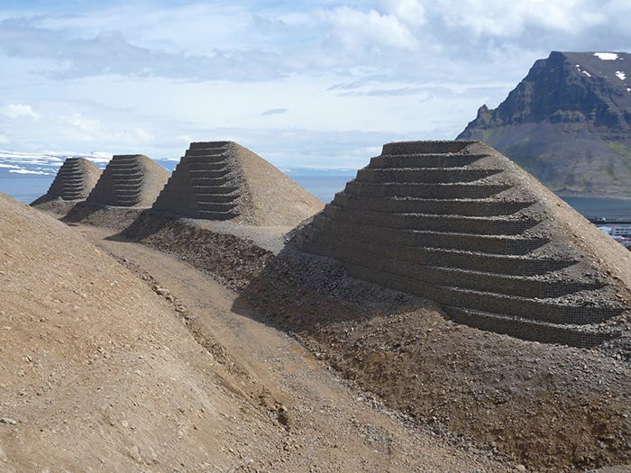 Four Pyramid look-alike sand piles with steps