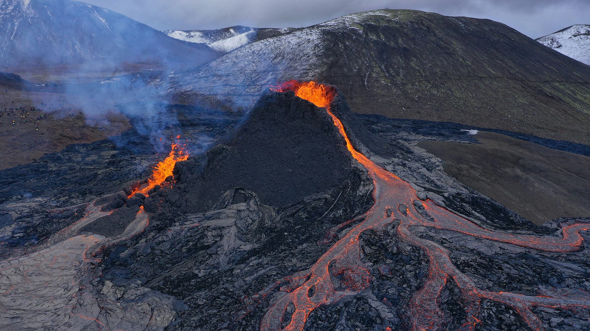 Fresh lava flow coming from a crater